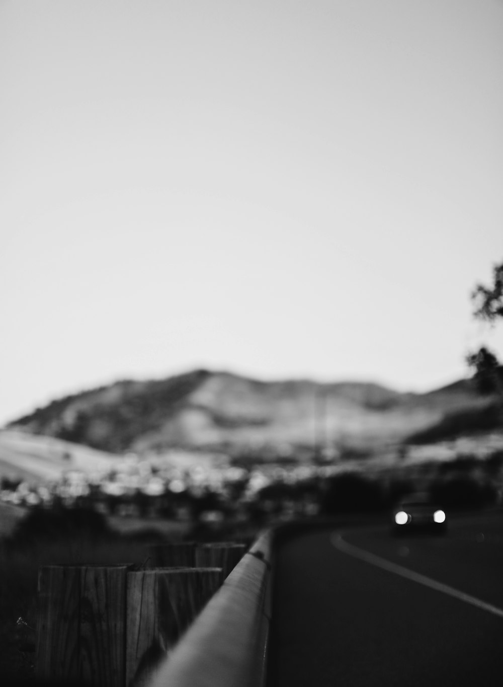 grayscale photo of car on road