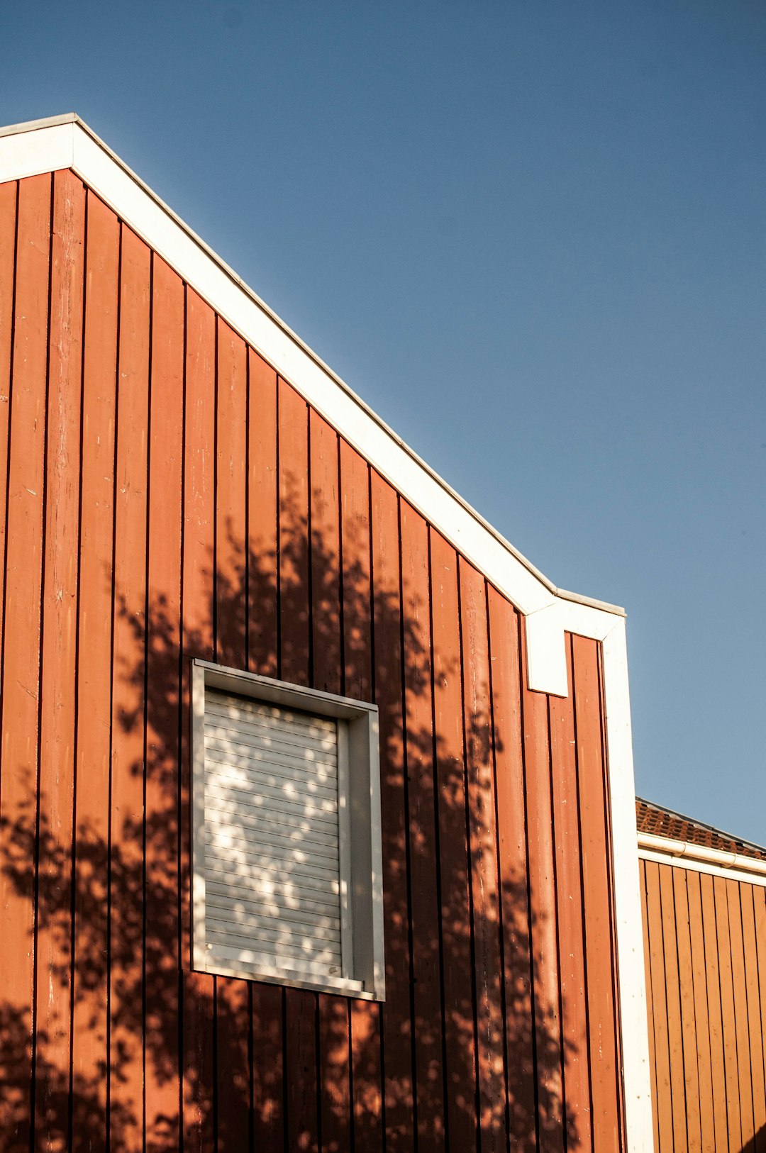 brown wooden house under blue sky during daytime