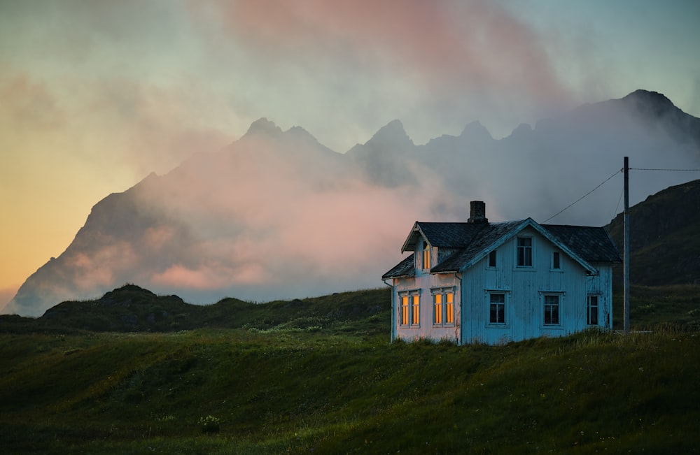 white and brown house on green grass field