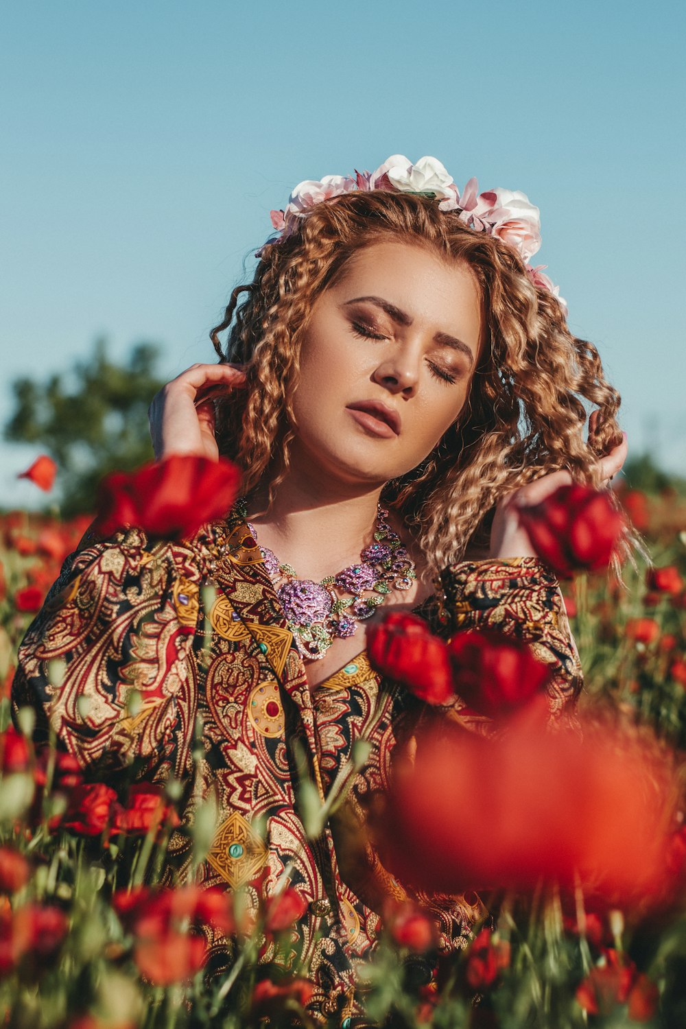 woman in red and yellow floral dress