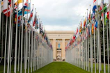 A panoramic view of the United Nations headquarters with flags waving.