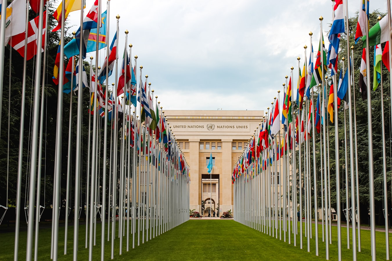 Walkway lined with flags to united nations building