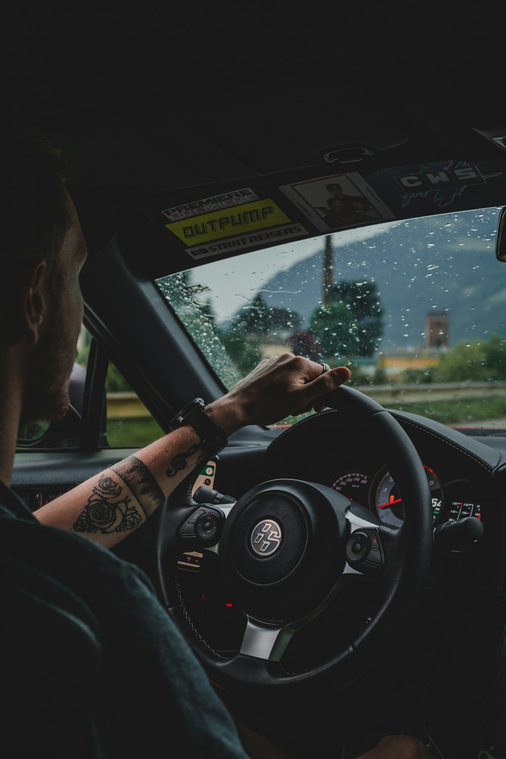 person driving car during daytime