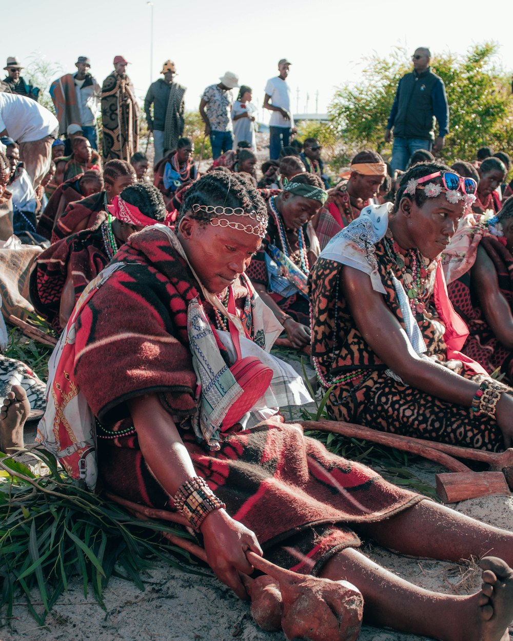 people sitting on green grass field during daytime