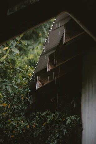 Rain falling on a heavy-duty shed cover, showcasing its water-resistant quality.