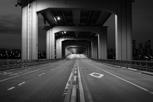 grayscale photo of empty hallway