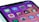 A close-up view of a smartphone screen displaying various app icons on a gradient background. The icons include Messages, App Store, Settings with a notification badge, and Clock, among others.