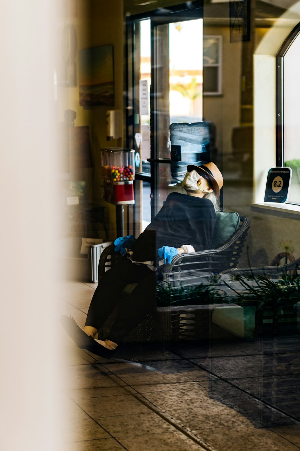 woman in blue hijab sitting on black chair