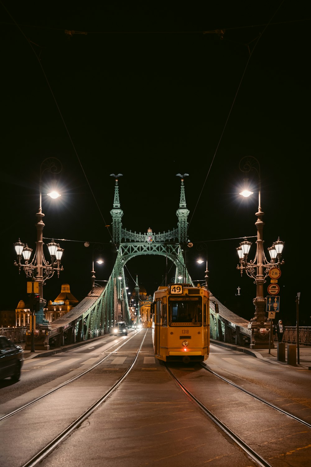 people walking on street near tram during night time