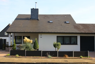 A modern single-family home with a landscaped front yard.