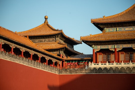 red and white temple under blue sky during daytime in Forbidden City China