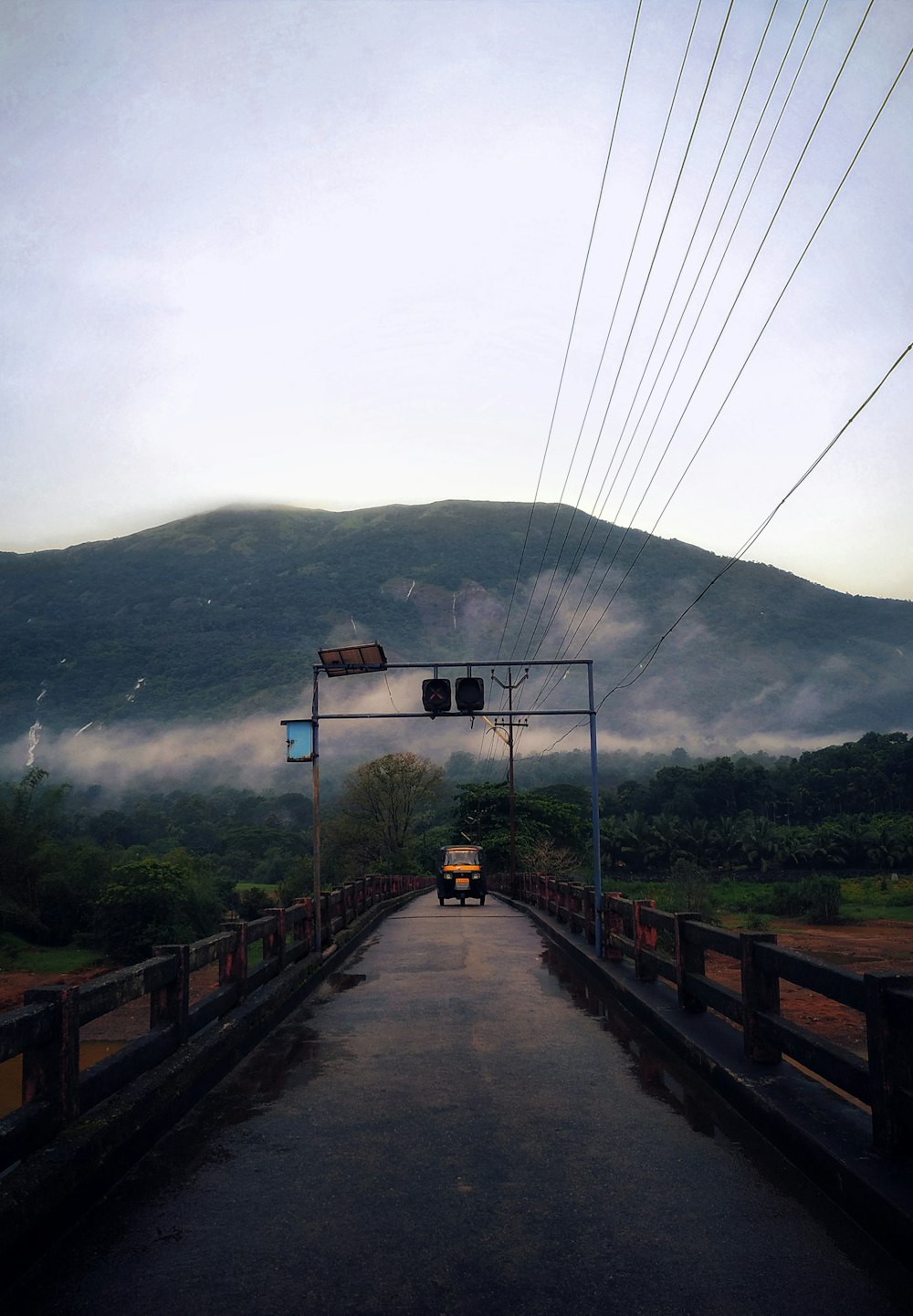 brown wooden bridge over river