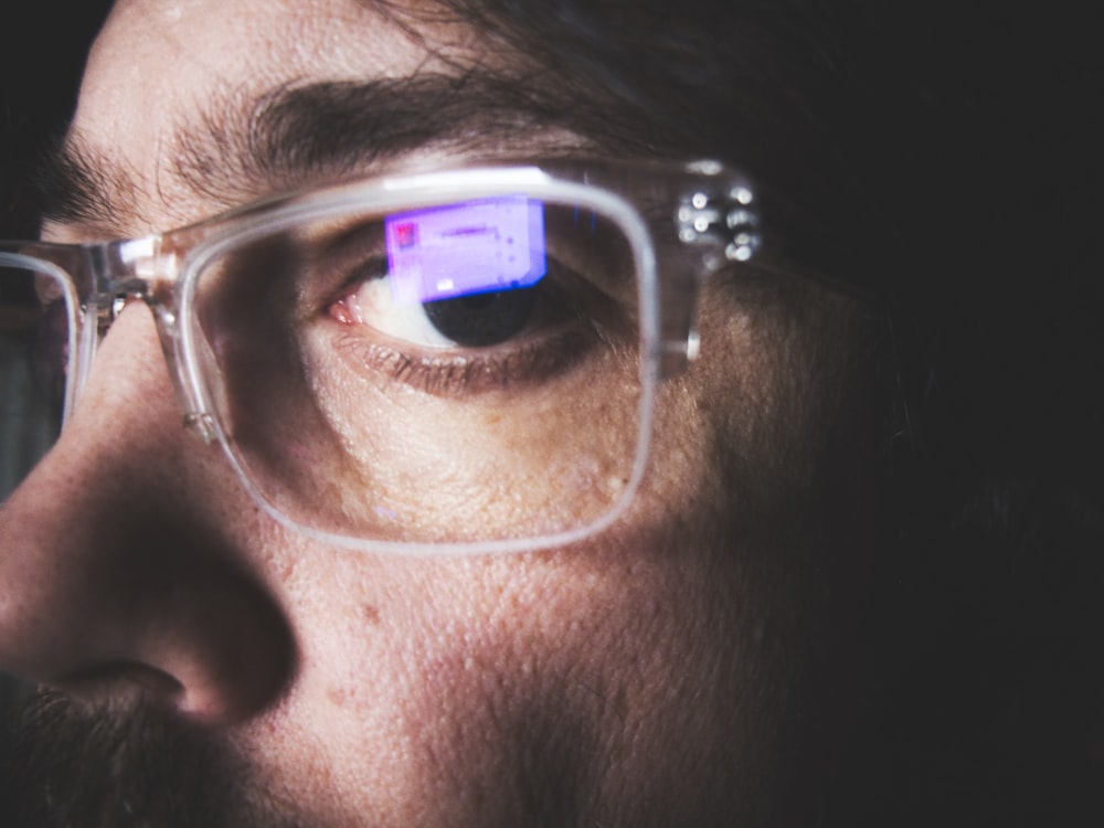 man wearing silver framed eyeglasses