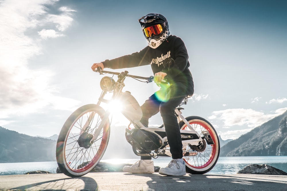 man in green jacket riding on motorcycle