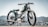 A vintage-style motorcycle is prominently displayed against an out-of-focus urban or mountainous landscape. The motorcycle has a sleek green and black design with number 77 painted on its fuel tank. It features a round headlight and spoked wheels, giving it a classic, retro aesthetic.
