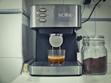 A sleek robotic espresso machine preparing a perfect cup of coffee.
