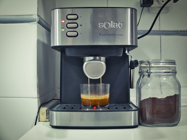 A sleek robotic coffee machine in action, showcasing precision brewing.