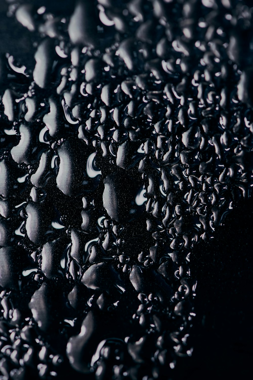 water droplets on black surface