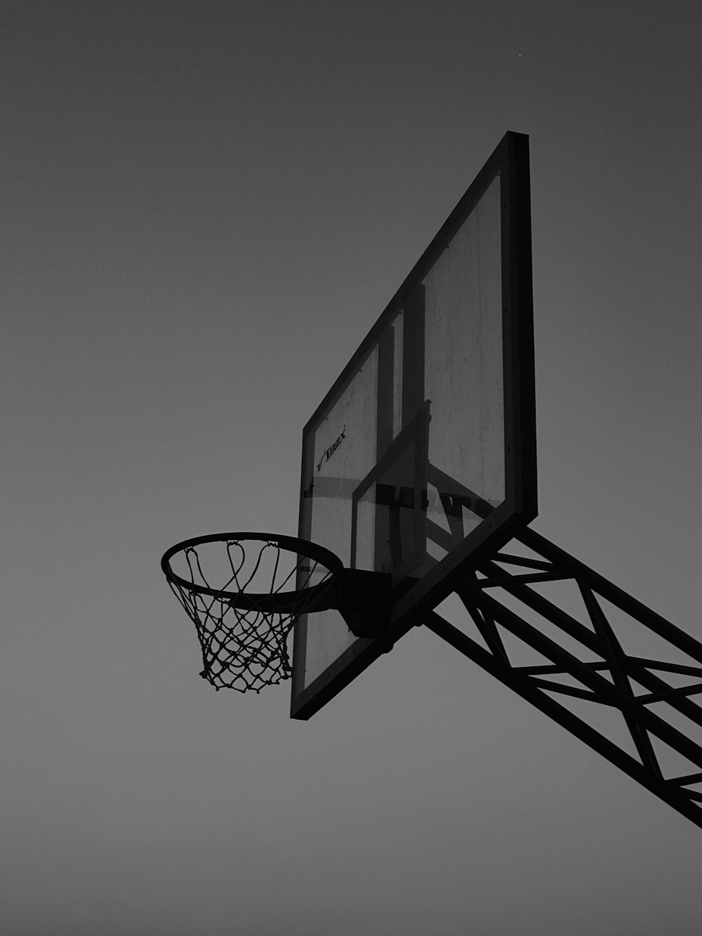 basketball hoop in grayscale photography
