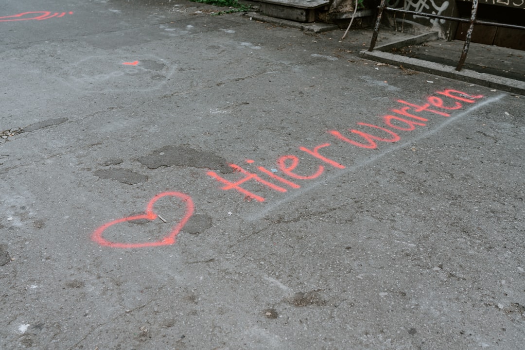 red and white love print on gray concrete floor