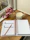 Elegant personalized agenda open on a wooden desk with pastel-colored pens and soft natural light.