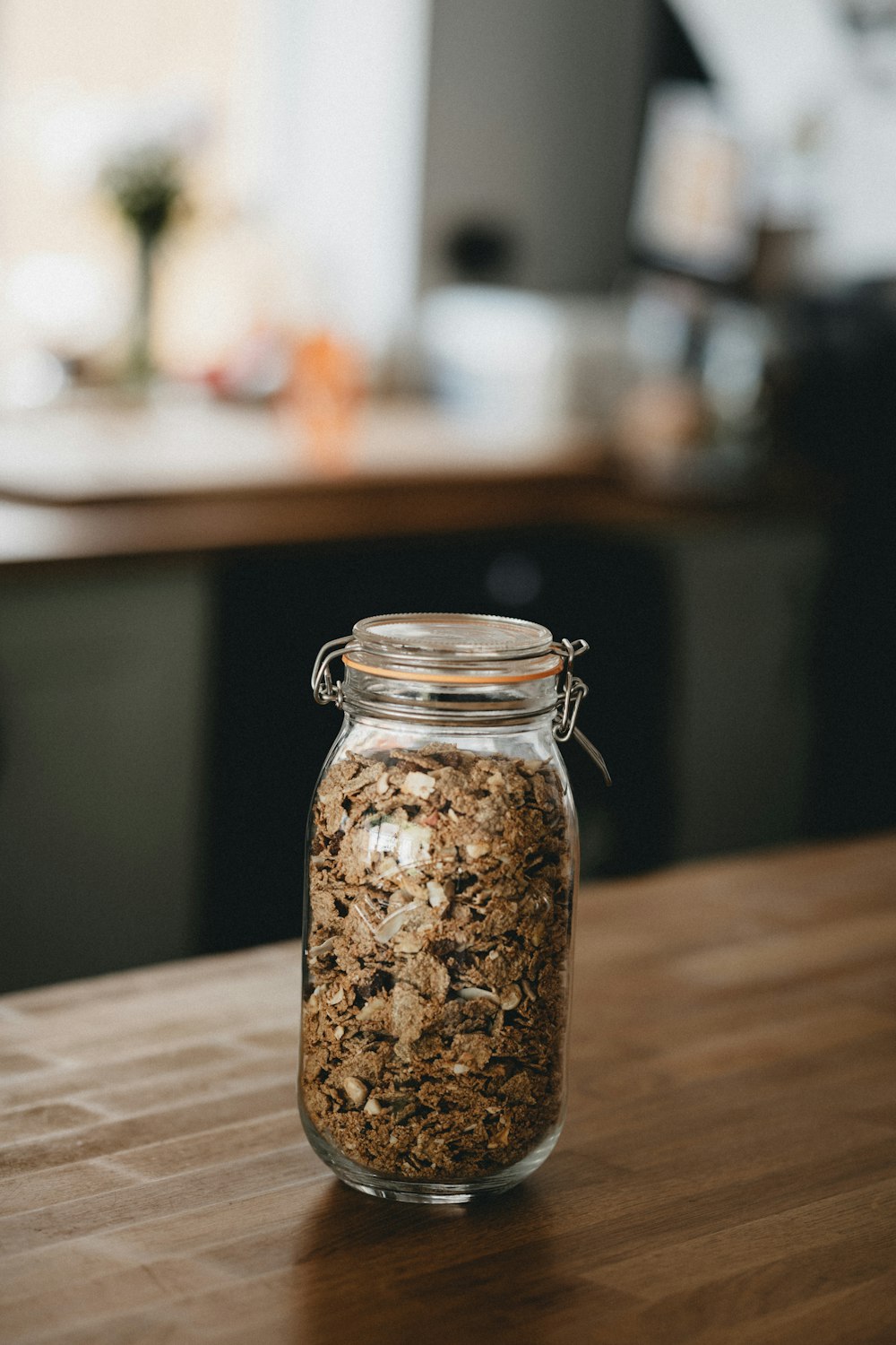 clear glass jar with brown powder inside