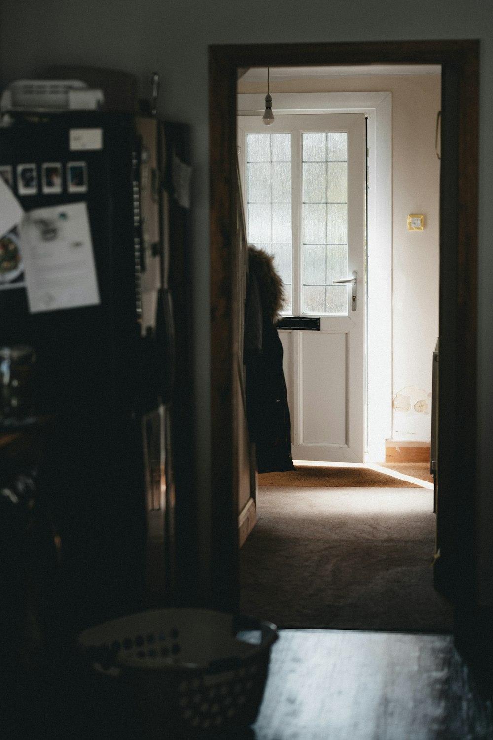 a woman standing in a doorway of a house