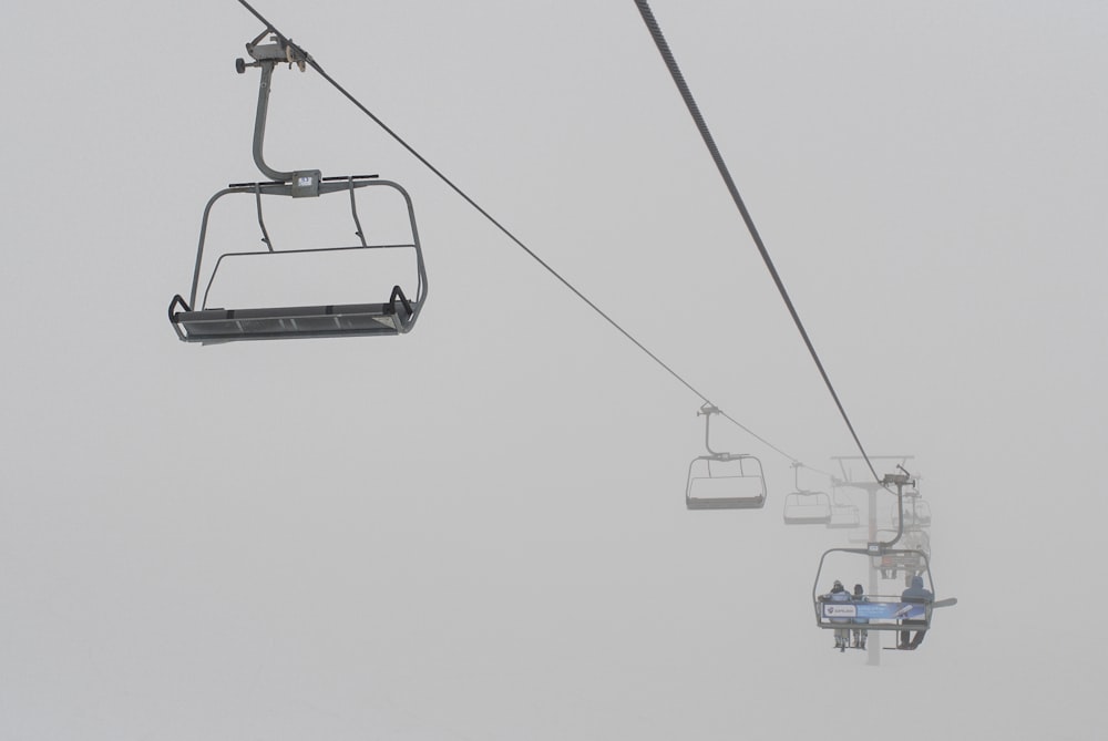 white and blue cable cars