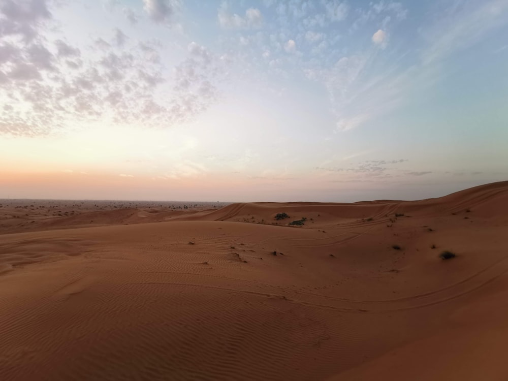 brown sand under blue sky during daytime