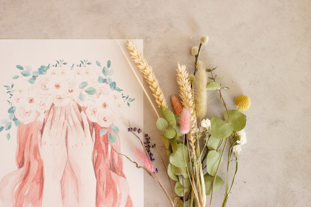 pink and yellow flowers on white surface