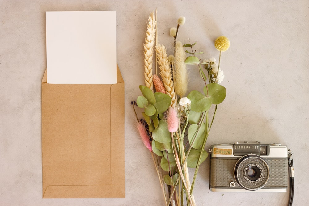 white and pink flowers on brown envelope