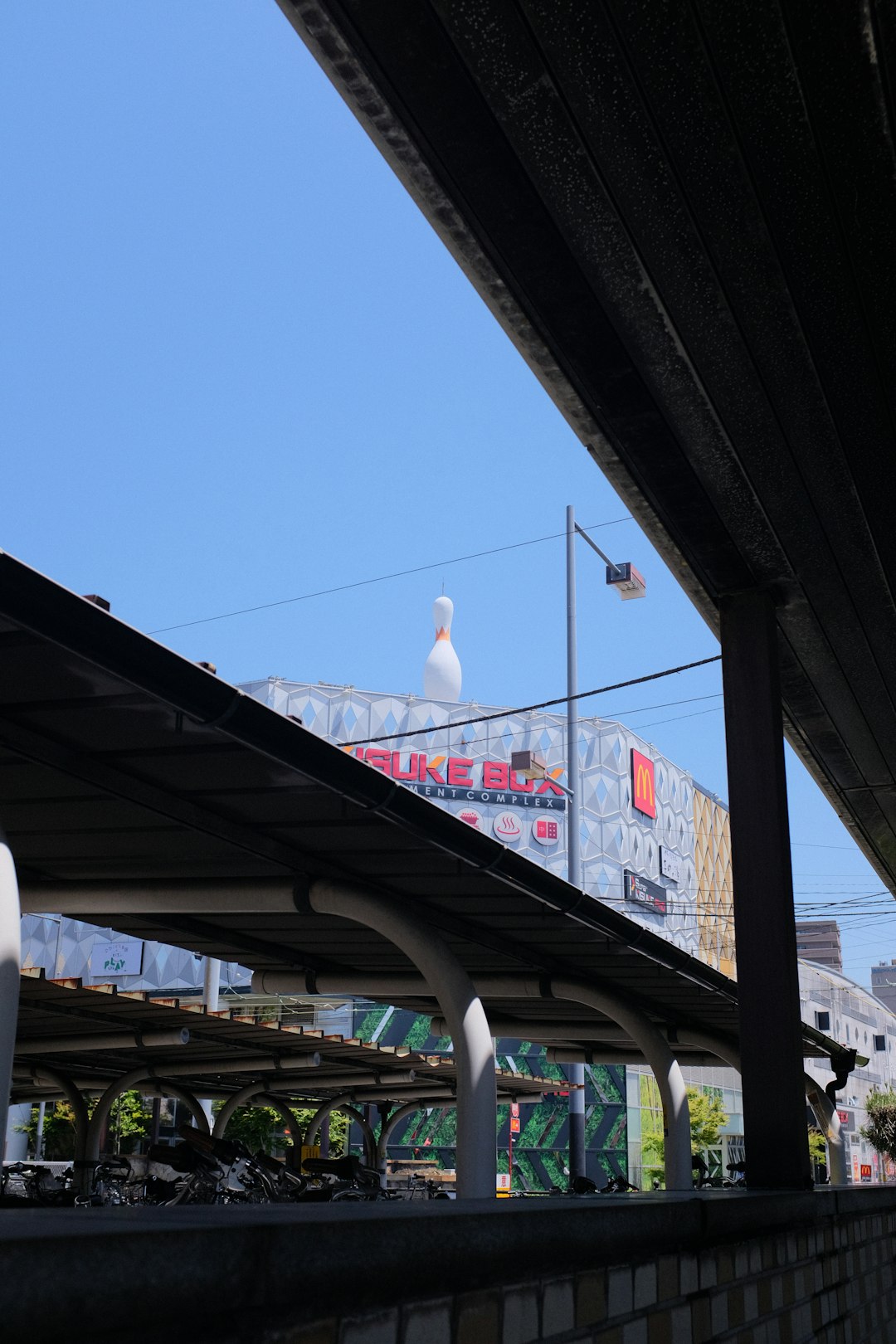 white and red bridge under blue sky during daytime