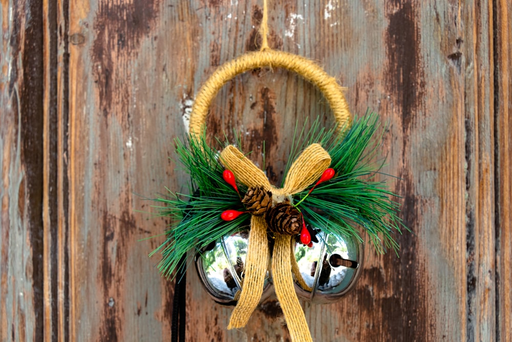 green and brown wreath on brown wooden wall