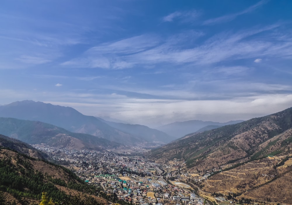 aerial view of city near mountains during daytime