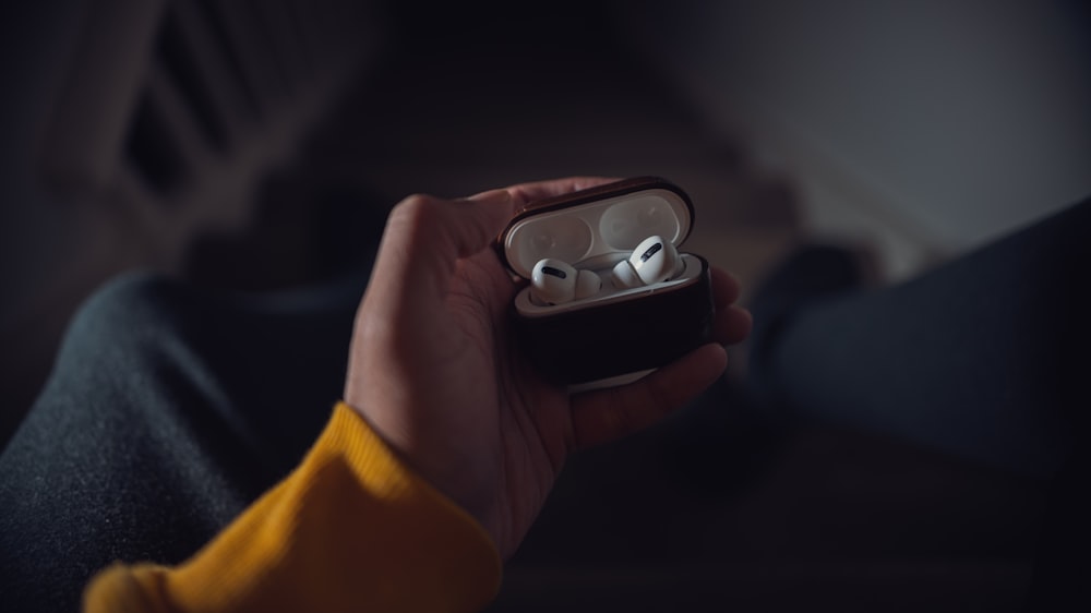 person holding black and white plastic toy