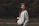 woman in gray zip up jacket standing on brown field during daytime