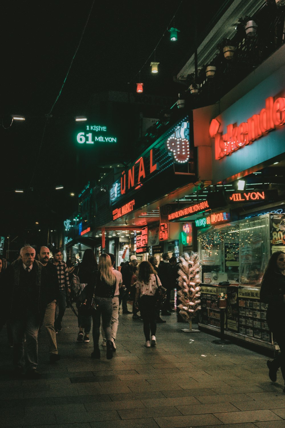 people walking on street during night time