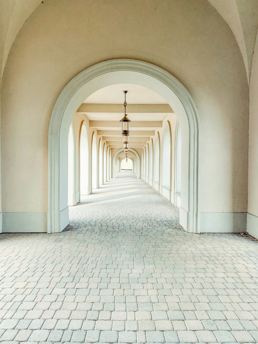 white concrete hallway with no people