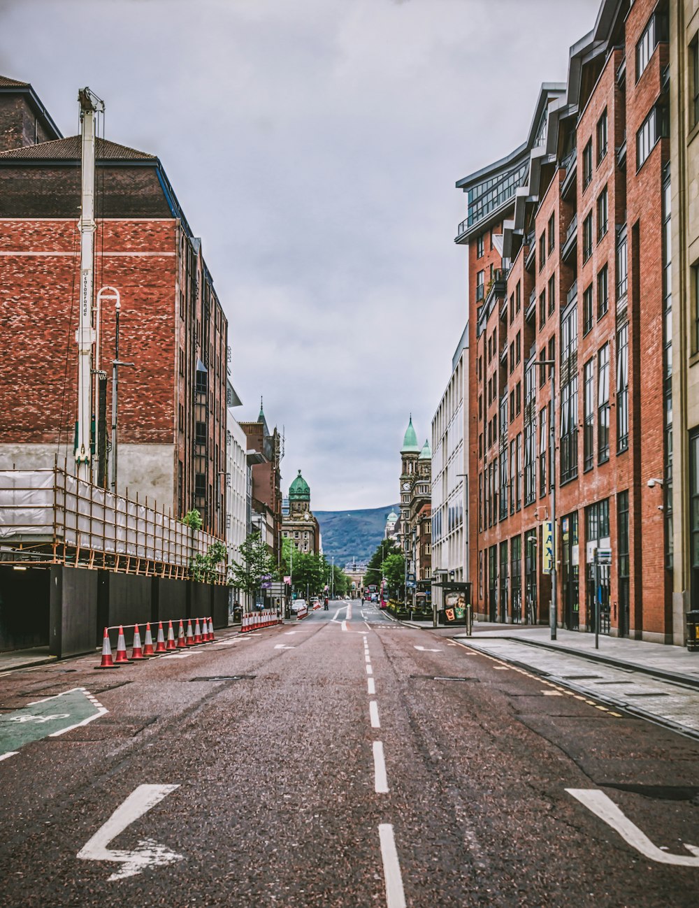 brown brick building beside road