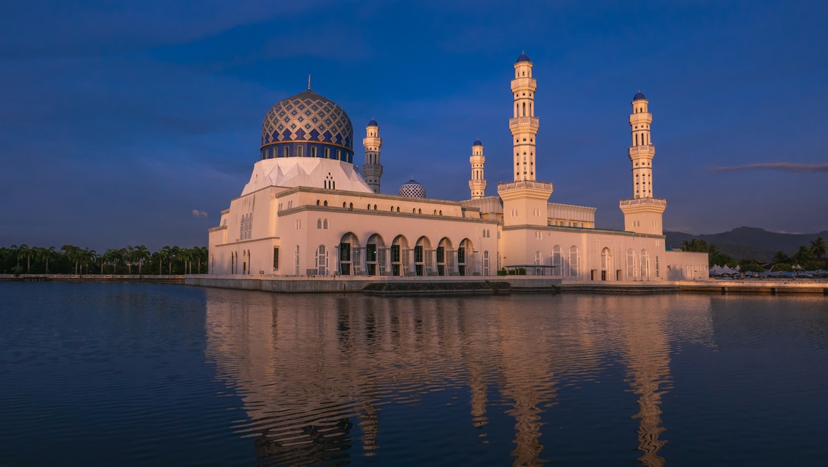 Kota Kinabalu January — State Mosque on the waterfront at dusk under heavy clouds