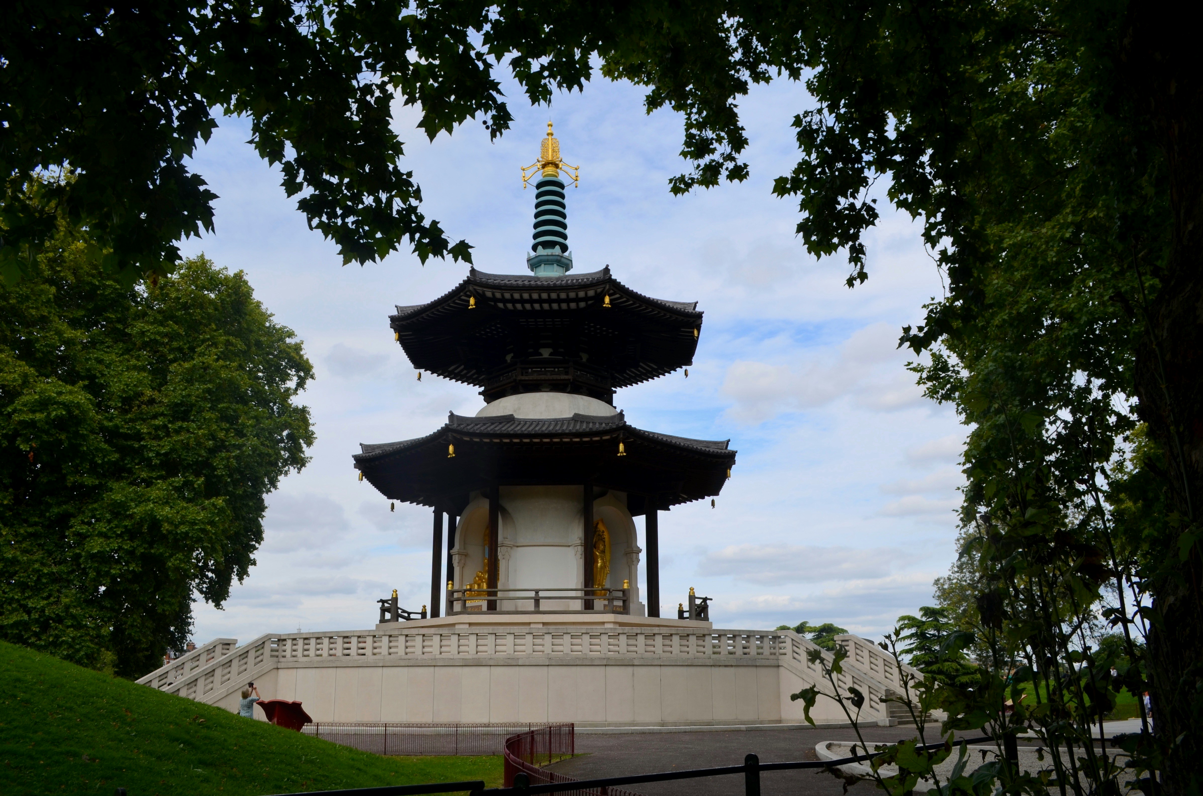 black and white temple under white clouds during daytime