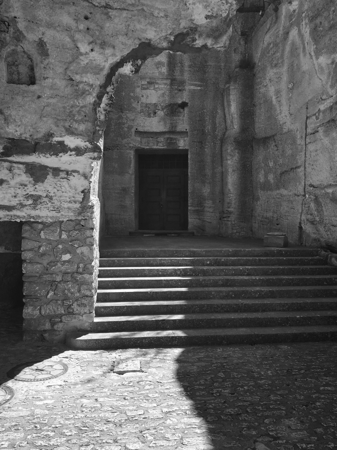 grayscale photo of concrete stairs