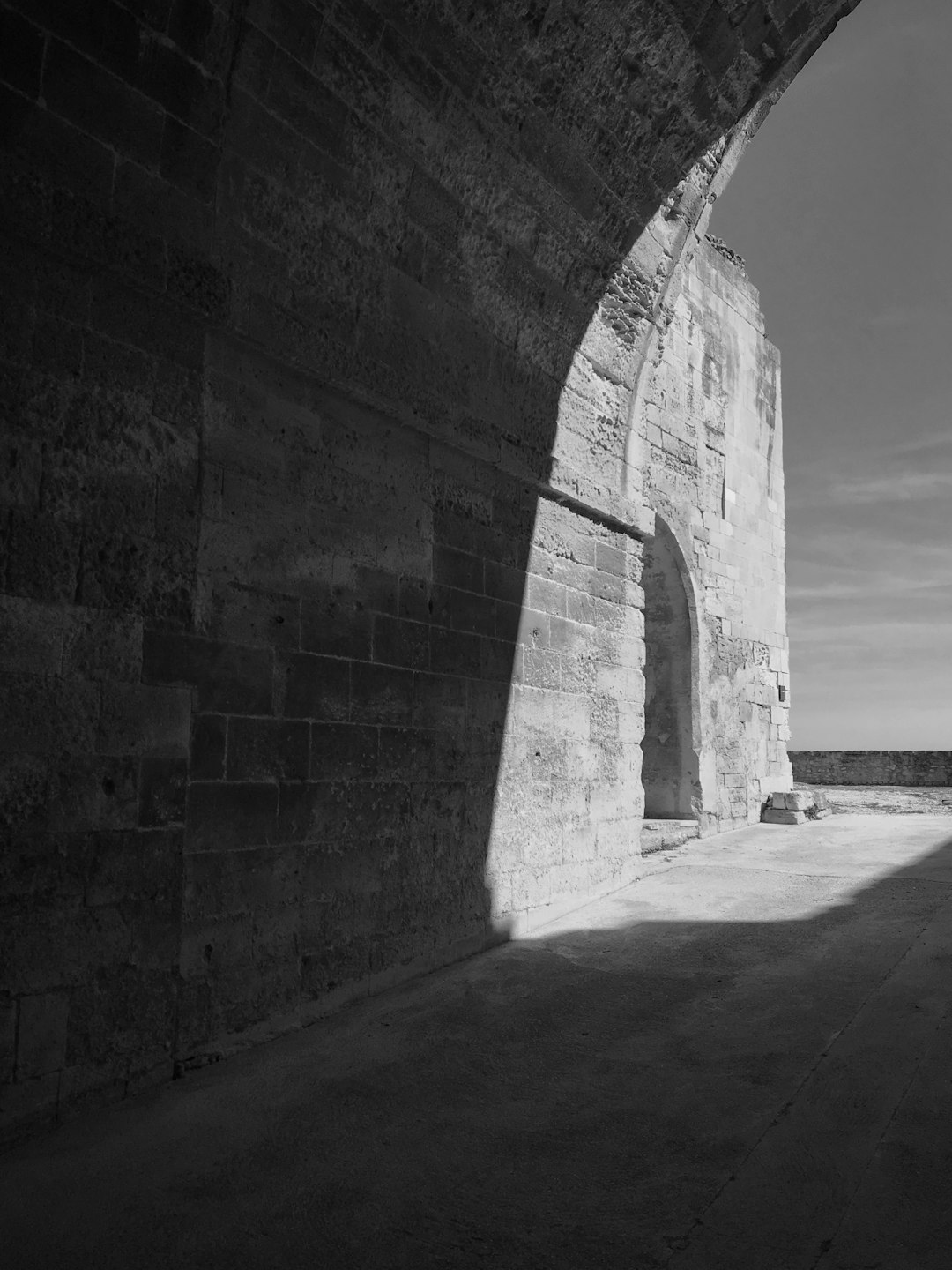 grayscale photo of concrete wall