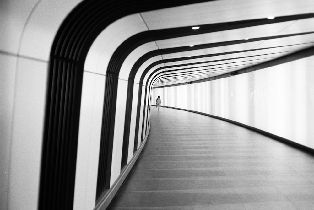 grayscale photo of a hallway