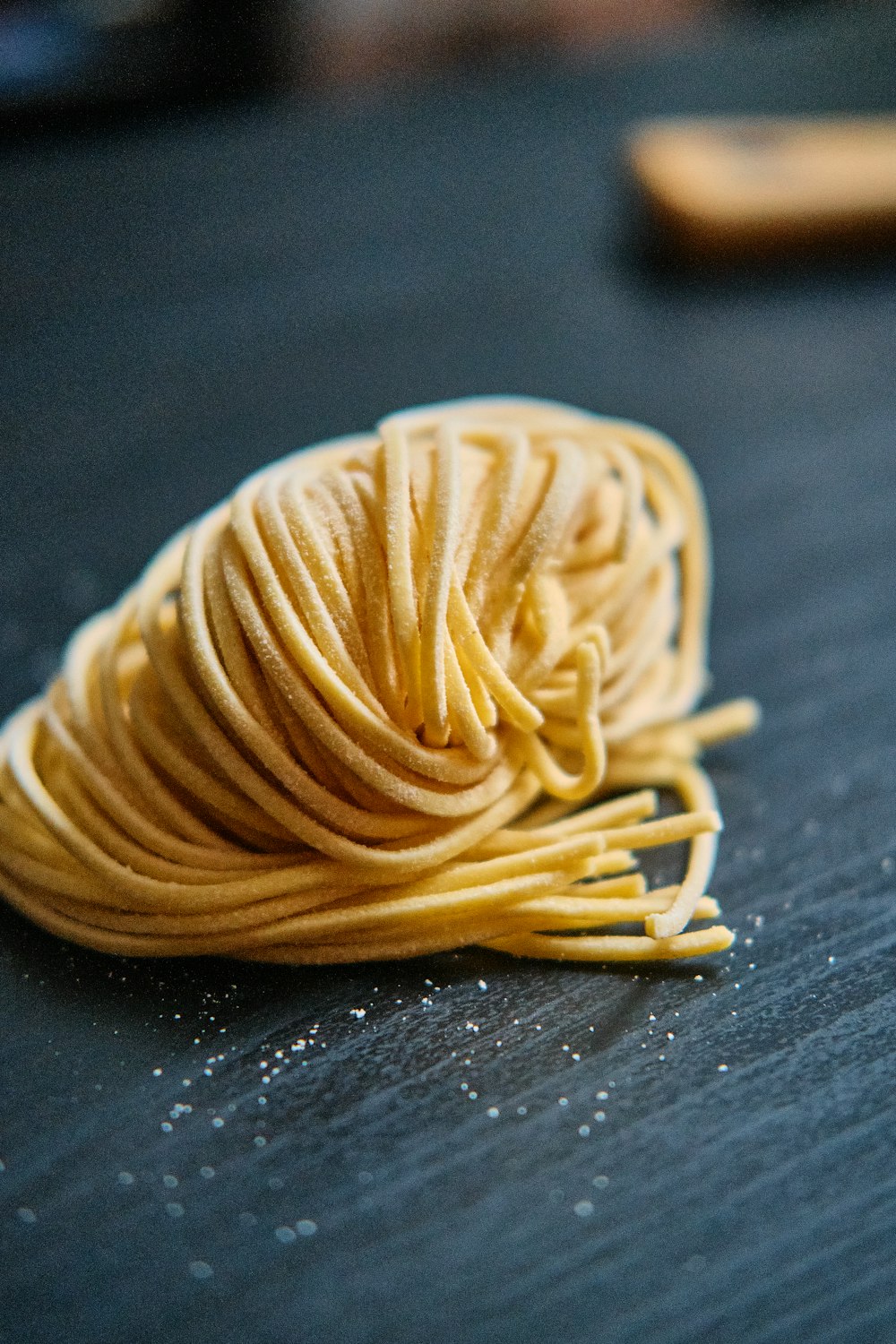yellow pasta on black table