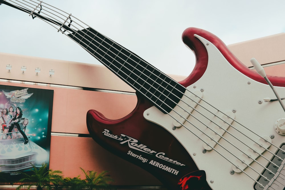 red and white electric guitar