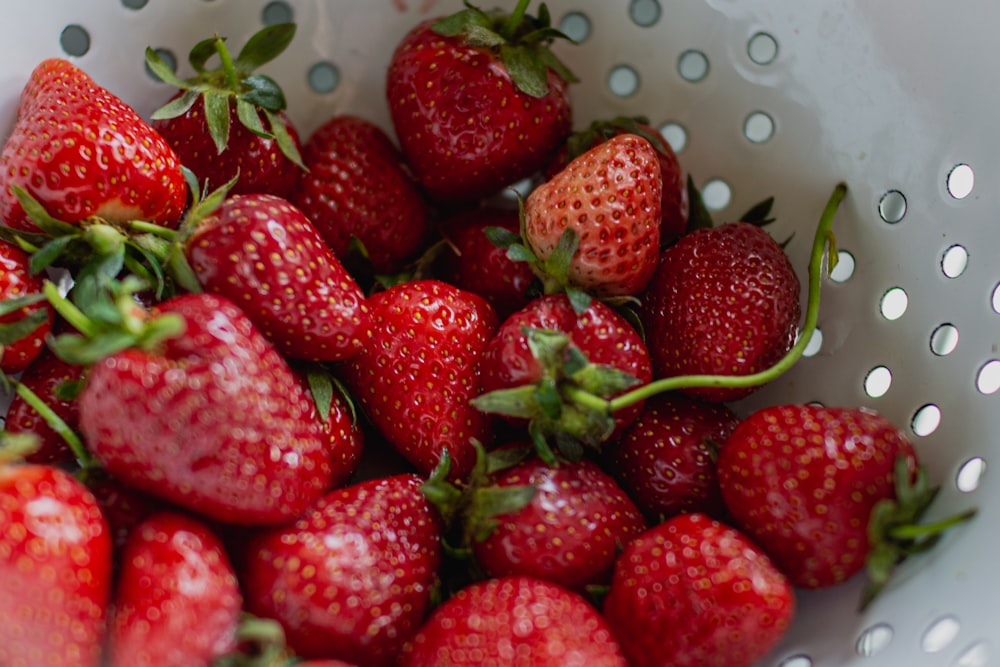 strawberries in white plastic basket