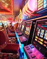 arcade machine with red and white chairs