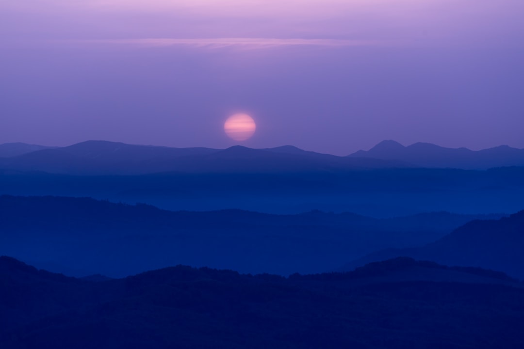 silhouette of mountains during sunset