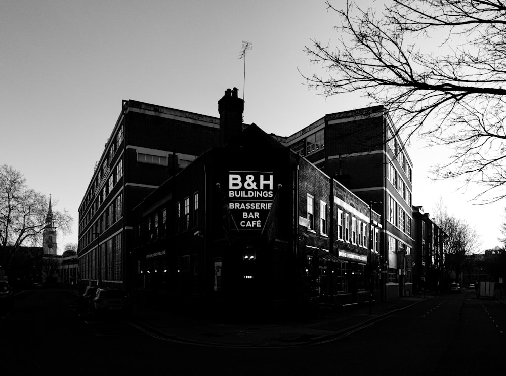 a black and white photo of a b & h building